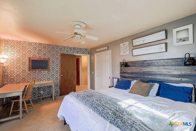 carpeted bedroom featuring ceiling fan