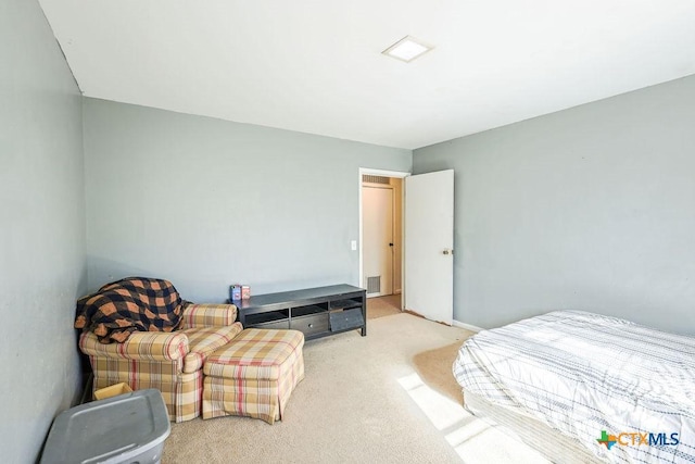 bedroom featuring light colored carpet