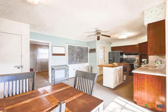 kitchen with wooden counters, sink, electric range, ceiling fan, and stainless steel fridge with ice dispenser