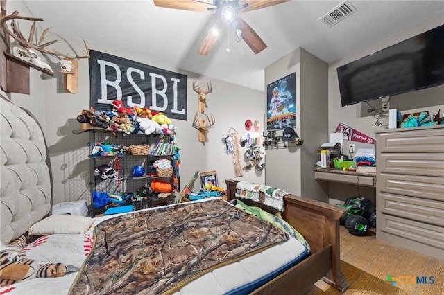 bedroom with a ceiling fan and visible vents