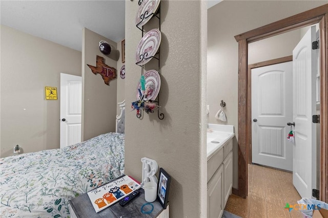 bedroom featuring light wood-style flooring