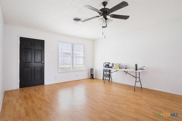 interior space featuring light hardwood / wood-style floors, ceiling fan, and ornamental molding