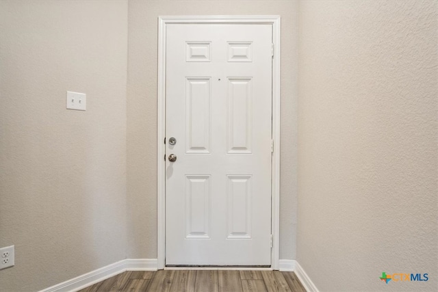 doorway featuring hardwood / wood-style floors