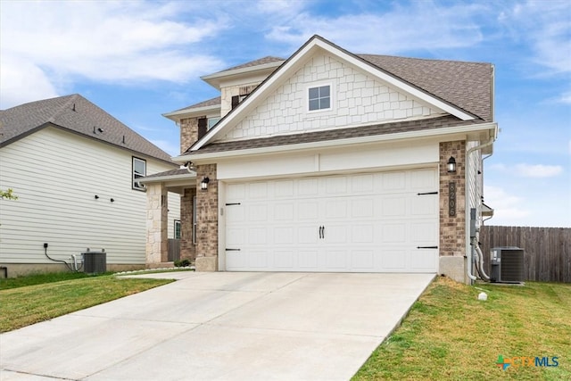 craftsman inspired home featuring a garage, cooling unit, and a front yard