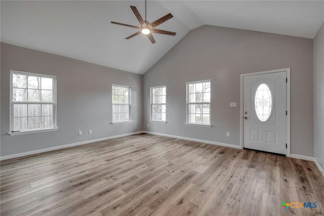 entrance foyer with light hardwood / wood-style flooring, ceiling fan, and lofted ceiling