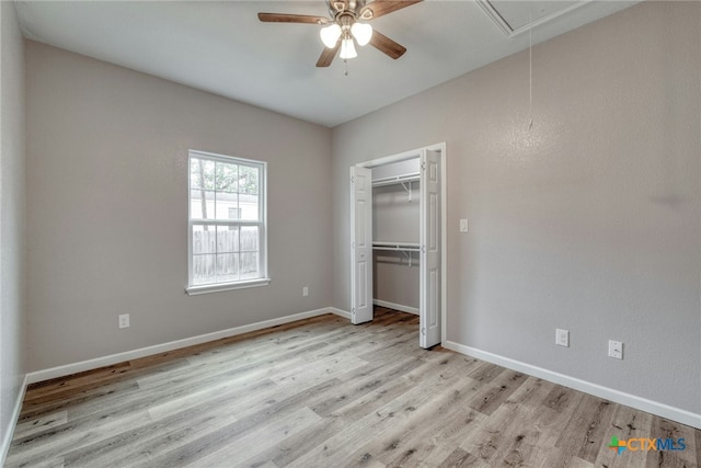 unfurnished bedroom featuring a closet, light hardwood / wood-style floors, and ceiling fan