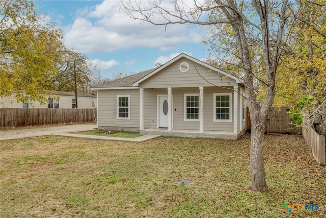 1408 Armstrong St, Luling, TX 78648 - view of front of home featuring a fenced backyard and covered porch