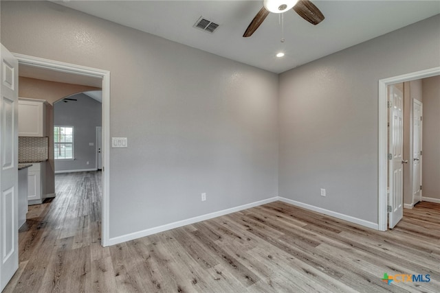 empty room featuring light hardwood / wood-style flooring and ceiling fan