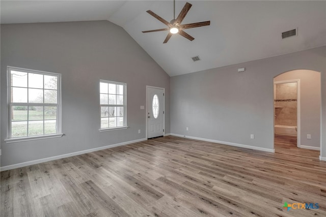 unfurnished living room featuring ceiling fan, high vaulted ceiling, and light hardwood / wood-style floors