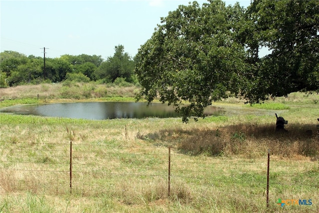 view of water feature with a rural view