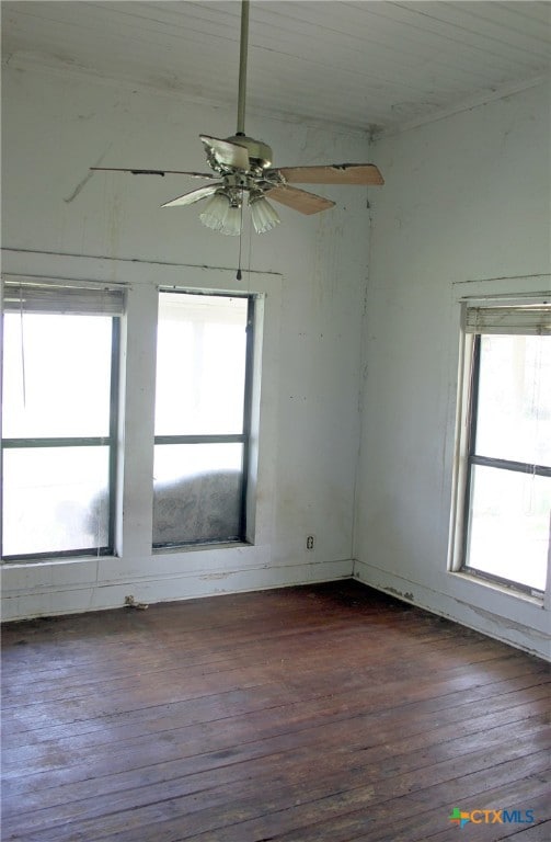 unfurnished room featuring dark hardwood / wood-style floors and ceiling fan