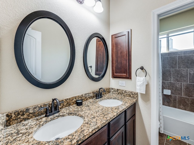 bathroom featuring vanity and shower / tub combo