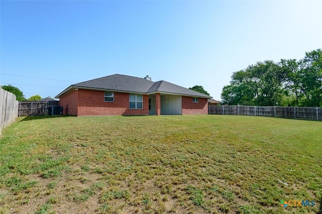 4902 Slate Ct, Killeen, TX 76542 - rear view of property featuring brick siding and central air condition unit