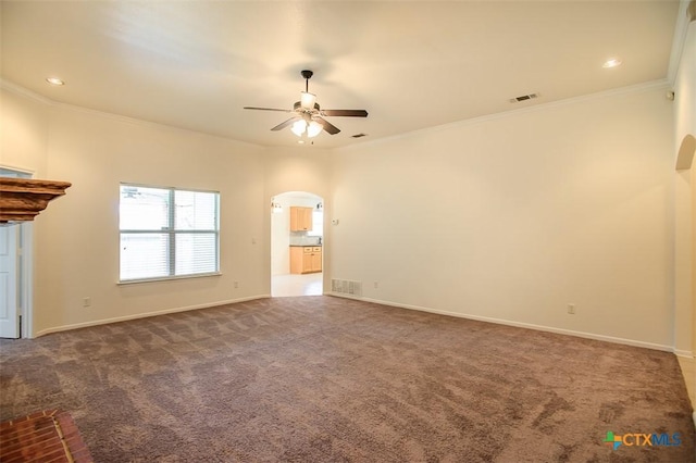 4902 Slate Ct, Killeen, TX 76542 - unfurnished living room featuring arched walkways, ceiling fan, carpet, ornamental molding, and baseboards
