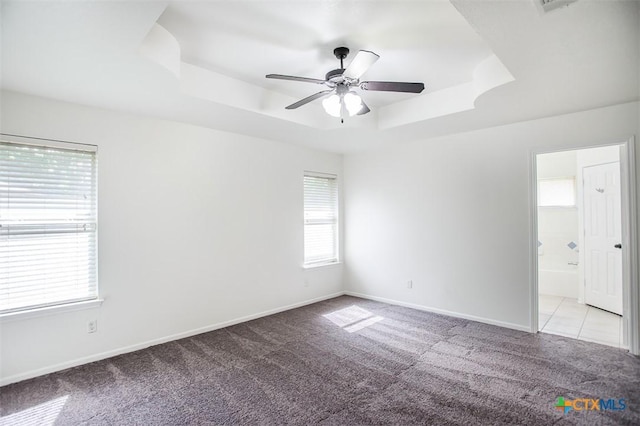 4902 Slate Ct, Killeen, TX 76542 - carpeted empty room featuring a tray ceiling, a ceiling fan, and baseboards