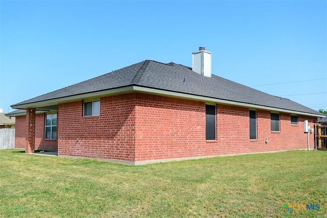 4902 Slate Ct, Killeen, TX 76542 - view of side of home featuring brick siding, a chimney, and roof with shingles