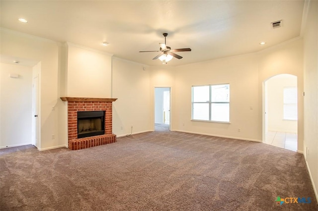 4902 Slate Ct, Killeen, TX 76542 - unfurnished living room with ceiling fan, a fireplace, carpet flooring, arched walkways, and ornamental molding