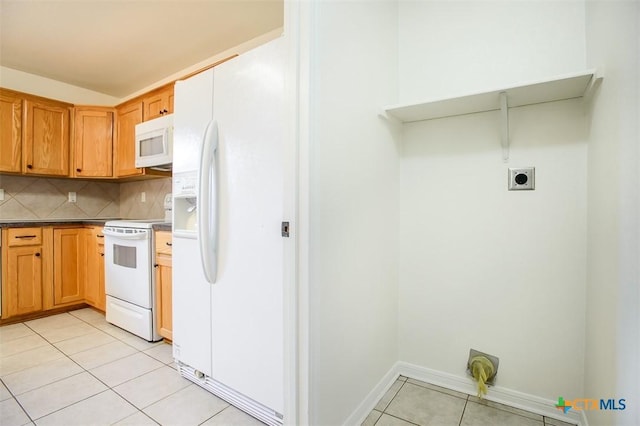 4902 Slate Ct, Killeen, TX 76542 - kitchen with white appliances, light tile patterned flooring, tasteful backsplash, and dark countertops