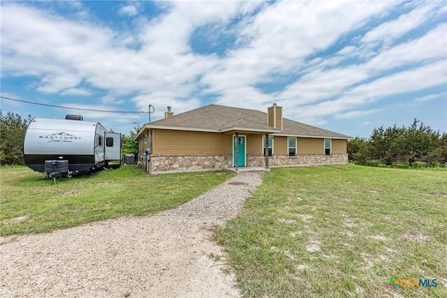 view of front of home with a front lawn