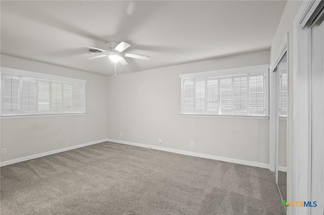 unfurnished bedroom with carpet floors and ceiling fan