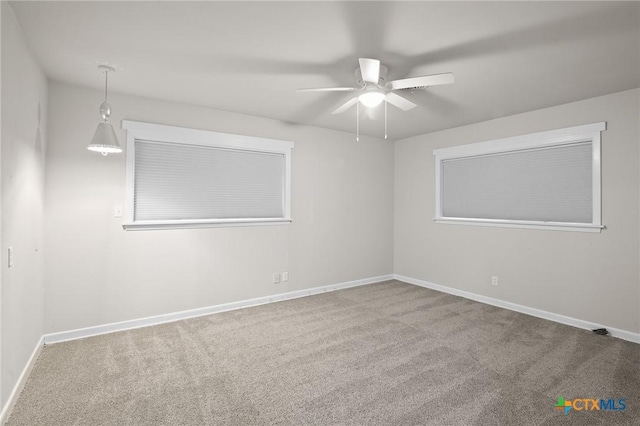 carpeted empty room with ceiling fan