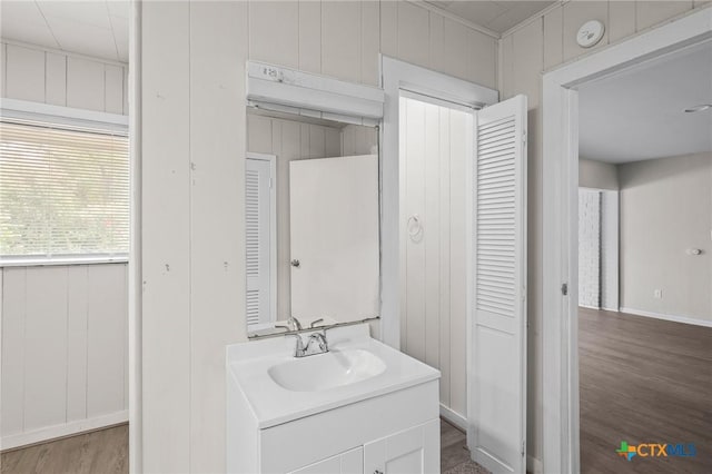 bathroom with vanity and hardwood / wood-style floors