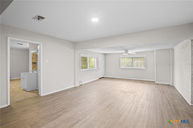 interior space with wood-type flooring and ceiling fan