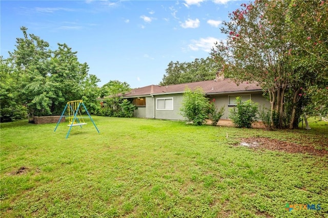 view of yard featuring a playground