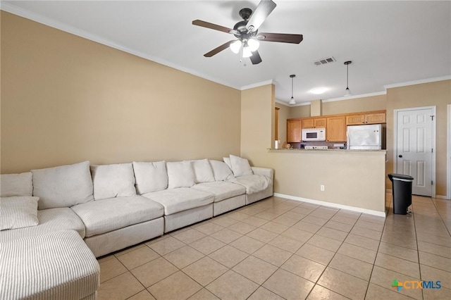 living area featuring visible vents, light tile patterned flooring, a ceiling fan, and crown molding