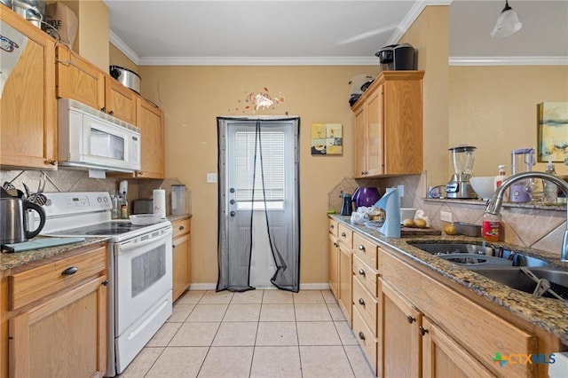 kitchen featuring white appliances, crown molding, tasteful backsplash, and a sink