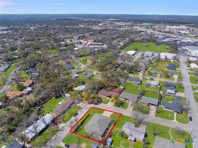 birds eye view of property with a residential view