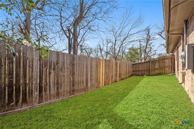 view of yard featuring a fenced backyard