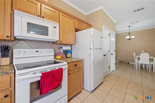 kitchen featuring visible vents, white appliances, light tile patterned flooring, and crown molding