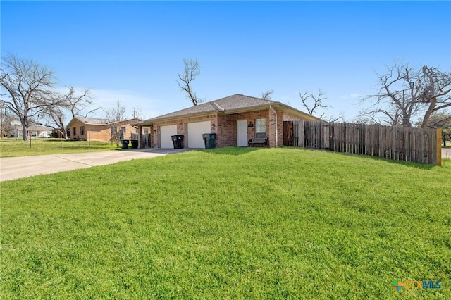 view of front facade featuring fence, an attached garage, a front lawn, concrete driveway, and brick siding