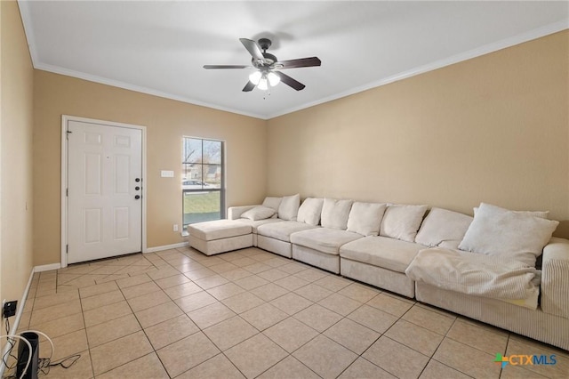 living room with ceiling fan, light tile patterned floors, baseboards, and ornamental molding