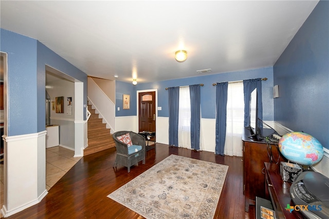 living room featuring dark wood-type flooring