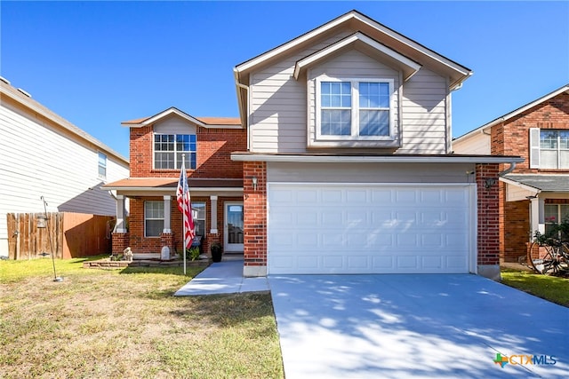 view of front of home featuring a garage and a front lawn