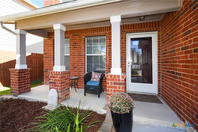 property entrance featuring covered porch