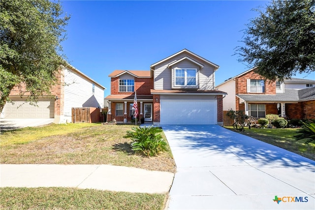 view of front of house featuring a front lawn and a garage