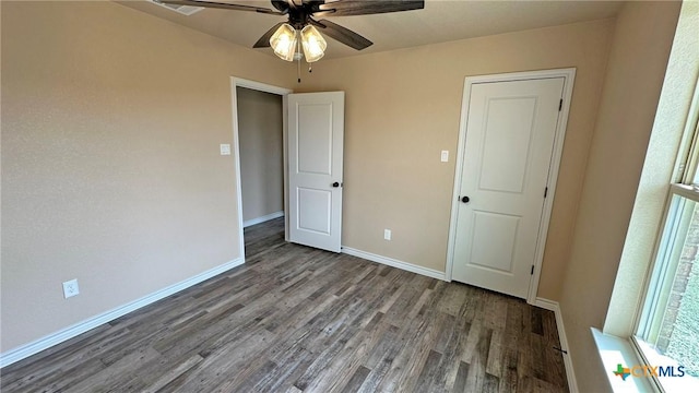 unfurnished bedroom with baseboards, ceiling fan, and wood finished floors