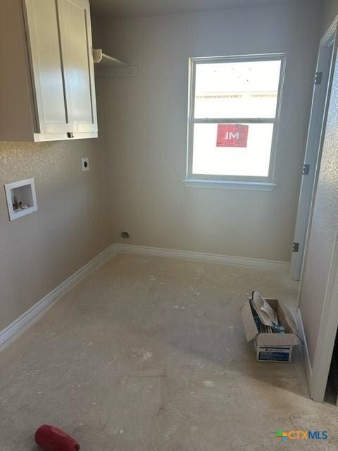 laundry room featuring hookup for a washing machine, hookup for an electric dryer, and cabinets