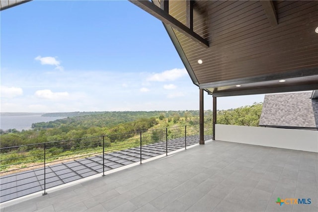 view of patio with a view of trees