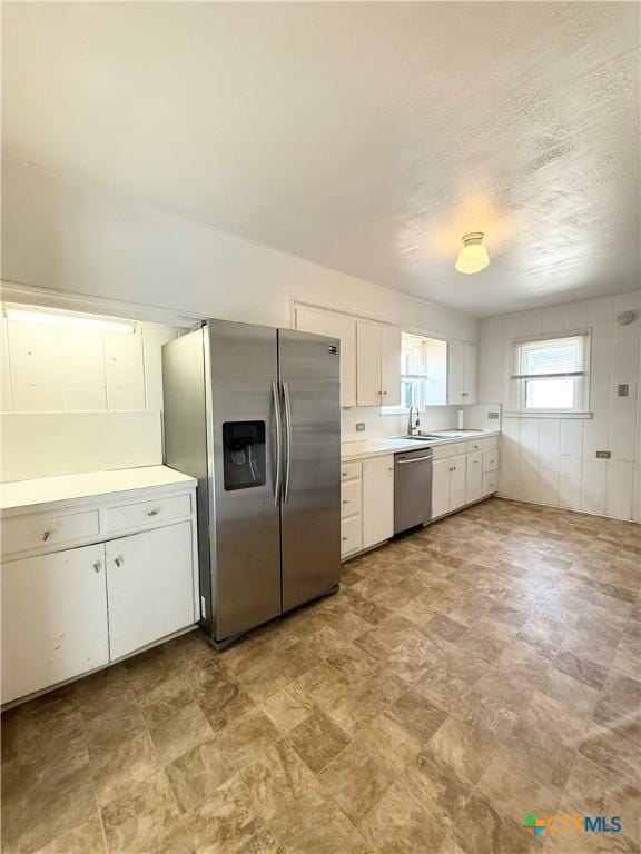 1500 N 5th St, Temple, TX 76501 - kitchen with stainless steel appliances, light countertops, white cabinets, and a sink
