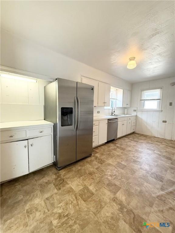 1500 N 5th St, Temple, TX 76501 - kitchen featuring stainless steel appliances, light countertops, and white cabinets