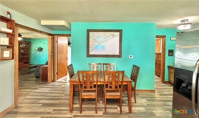 1007 W Monroe Ave, Port Oconnor, TX 77982 - dining space with wood finished floors and baseboards
