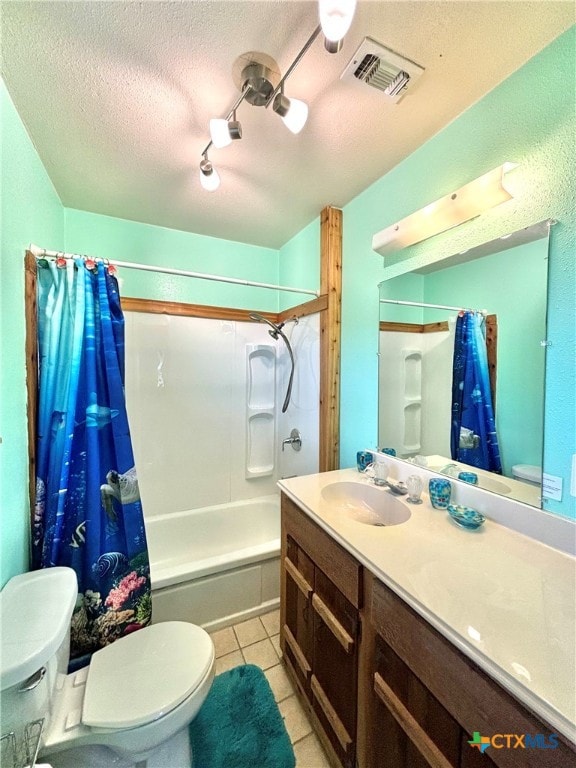 full bathroom featuring tile patterned flooring, vanity, toilet, shower / bathtub combination with curtain, and a textured ceiling