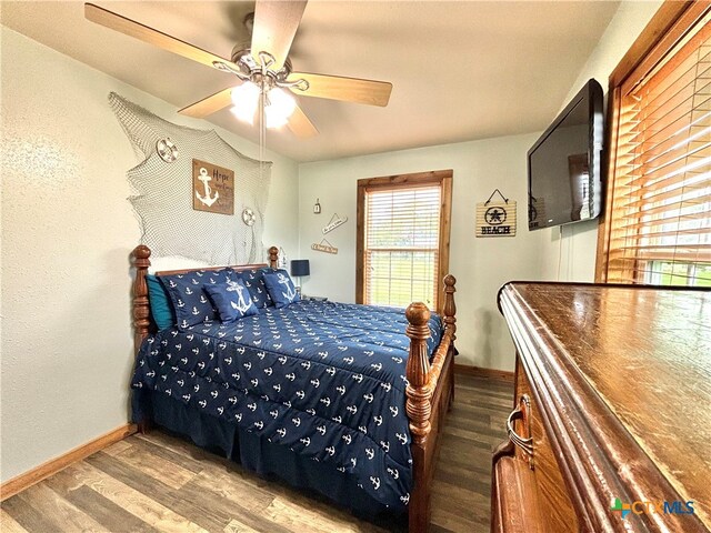 bedroom featuring ceiling fan and wood-type flooring