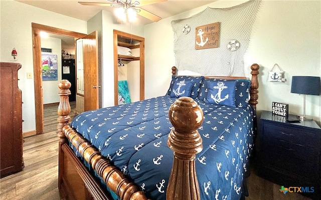 1007 W Monroe Ave, Port Oconnor, TX 77982 - bedroom featuring wood finished floors, a closet, and ceiling fan
