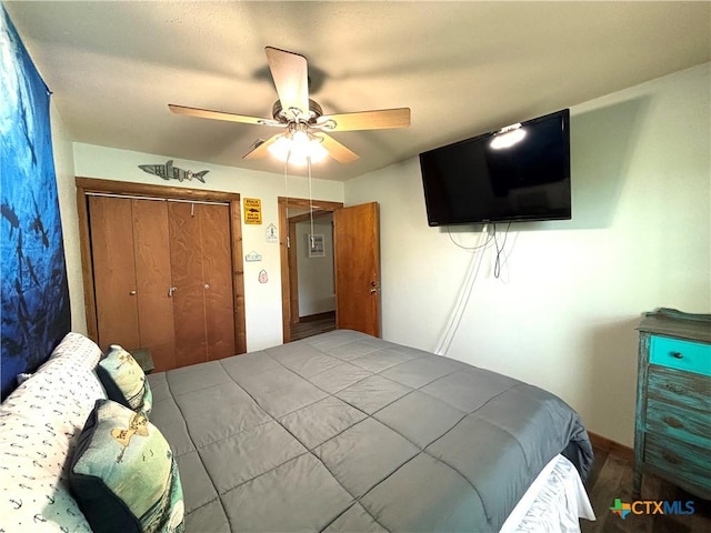 bedroom with ceiling fan and a closet