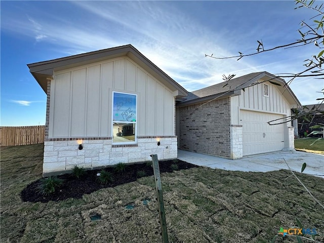 view of side of property with a garage